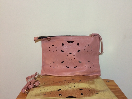 Blush pink and gold clutch bag